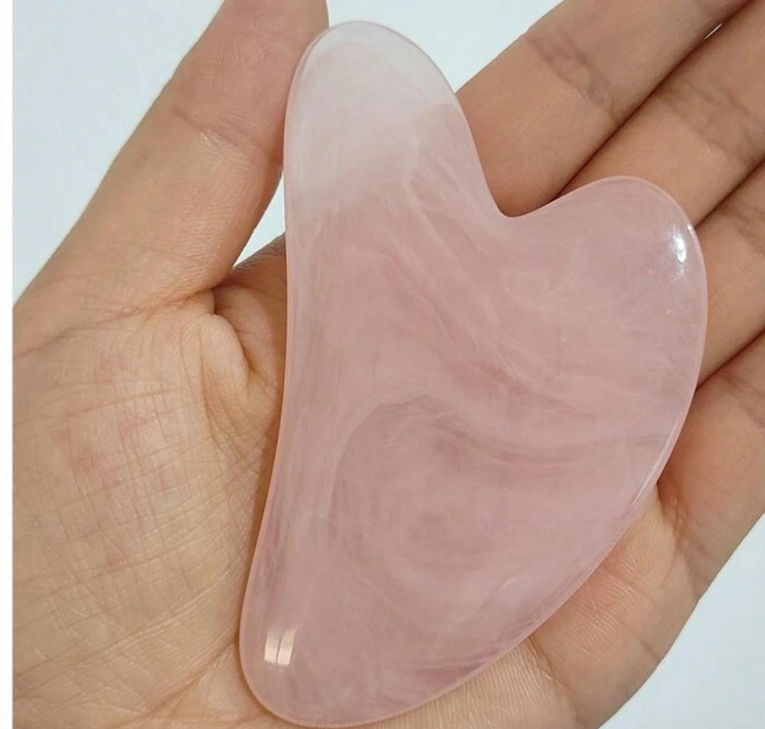 One facial massage tool green and pink| أداة تدليك الوجه الطبيعية