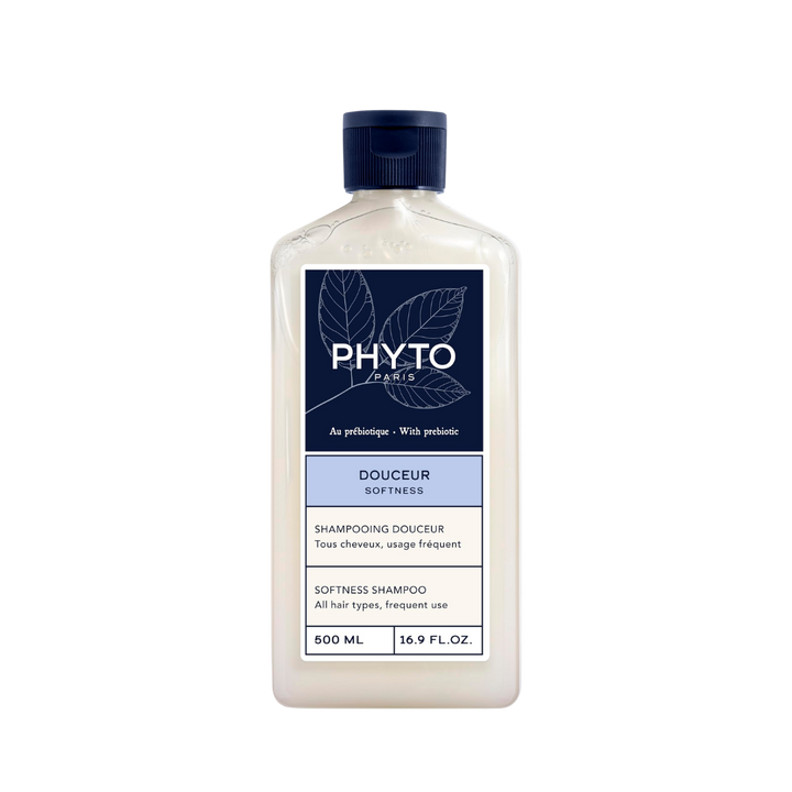PHYTO Douceur Softness Shampoo, 500ml translucent bottle with navy cap and blue label.