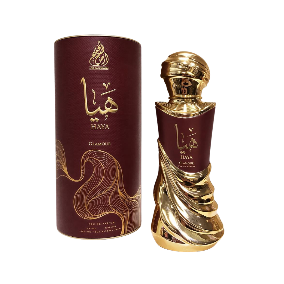 Ard Al Zaafaran Haya Glamour eau de parfum bottle with gold cap and maroon cylindrical box