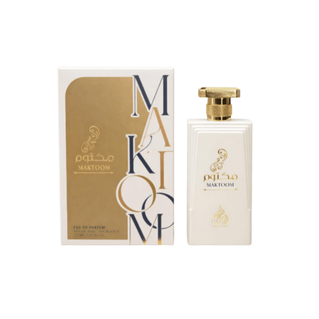 This image shows the perfume "Maktoom," housed in an elegant, white bottle with gold accents. The packaging features a sophisticated design with a modern touch.