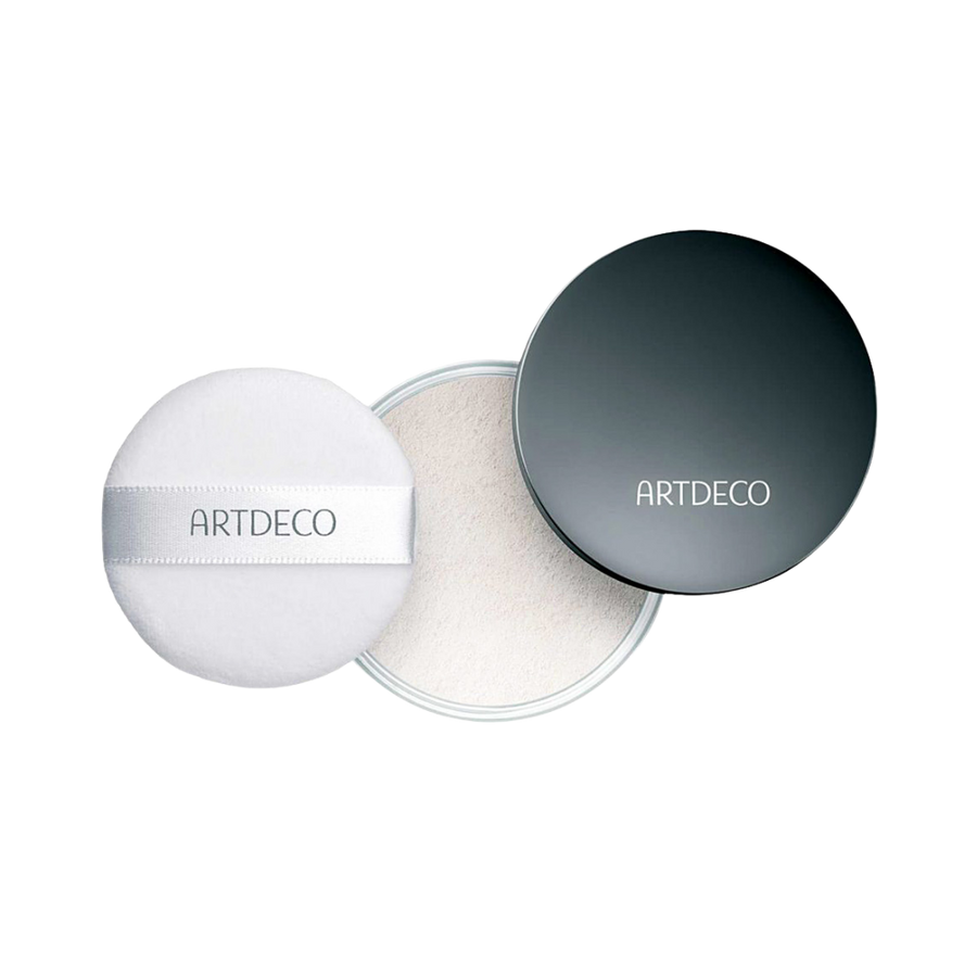 Artdeco translucent loose powder in a black container with a white puff.