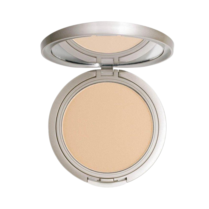 Compact pressed powder in a silver, circular case with a smooth, beige powder finish.