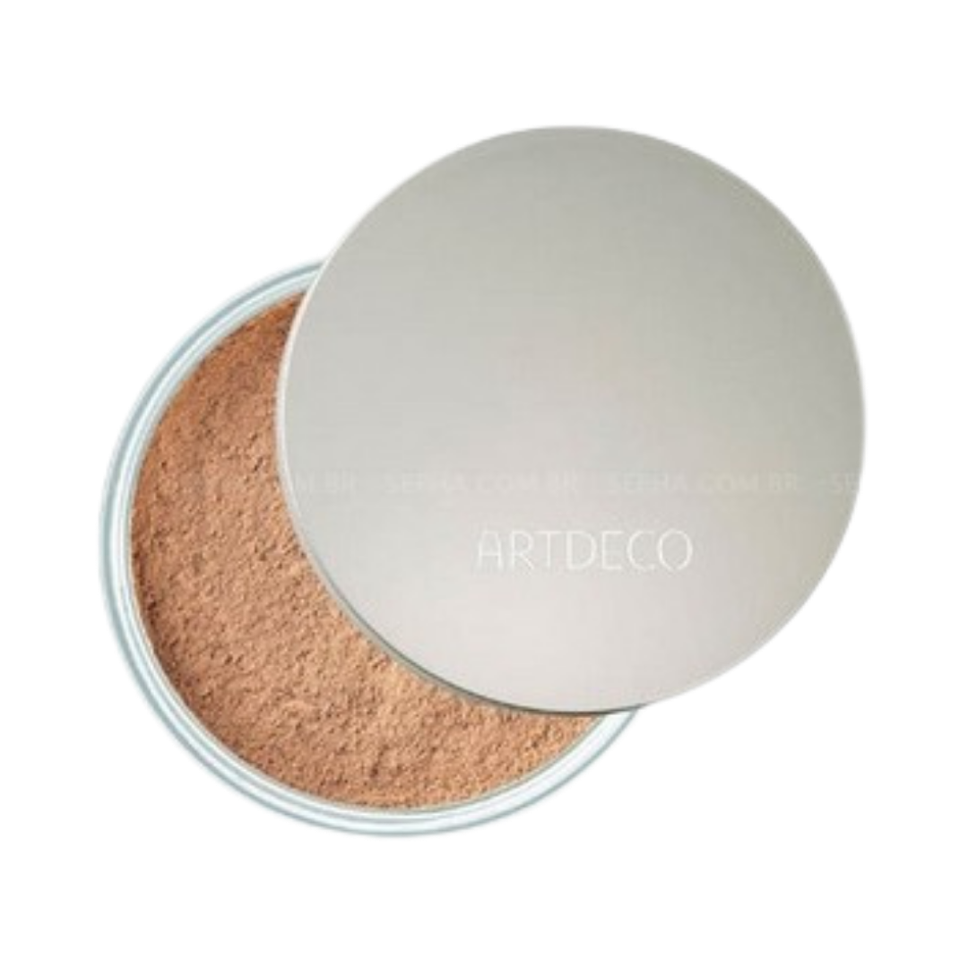 ARTDECO loose powder in a transparent container with a silver lid, offering a natural finish.