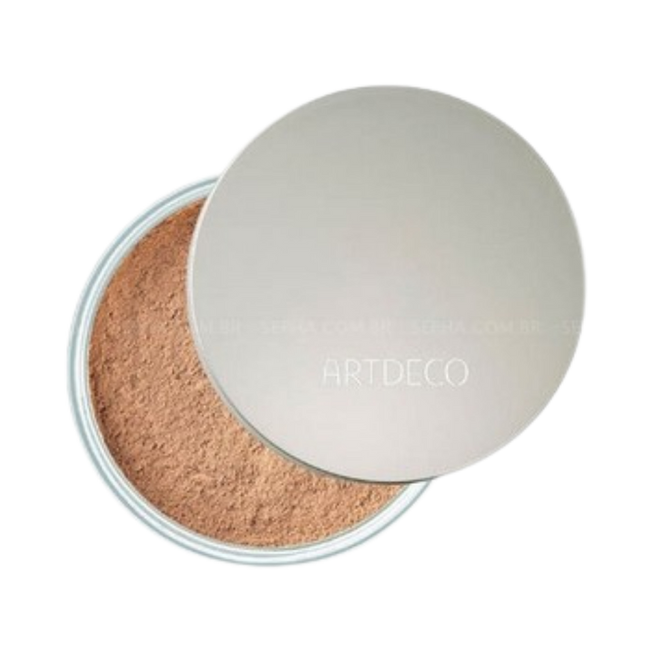 ARTDECO loose powder in a transparent container with a silver lid, offering a natural finish.