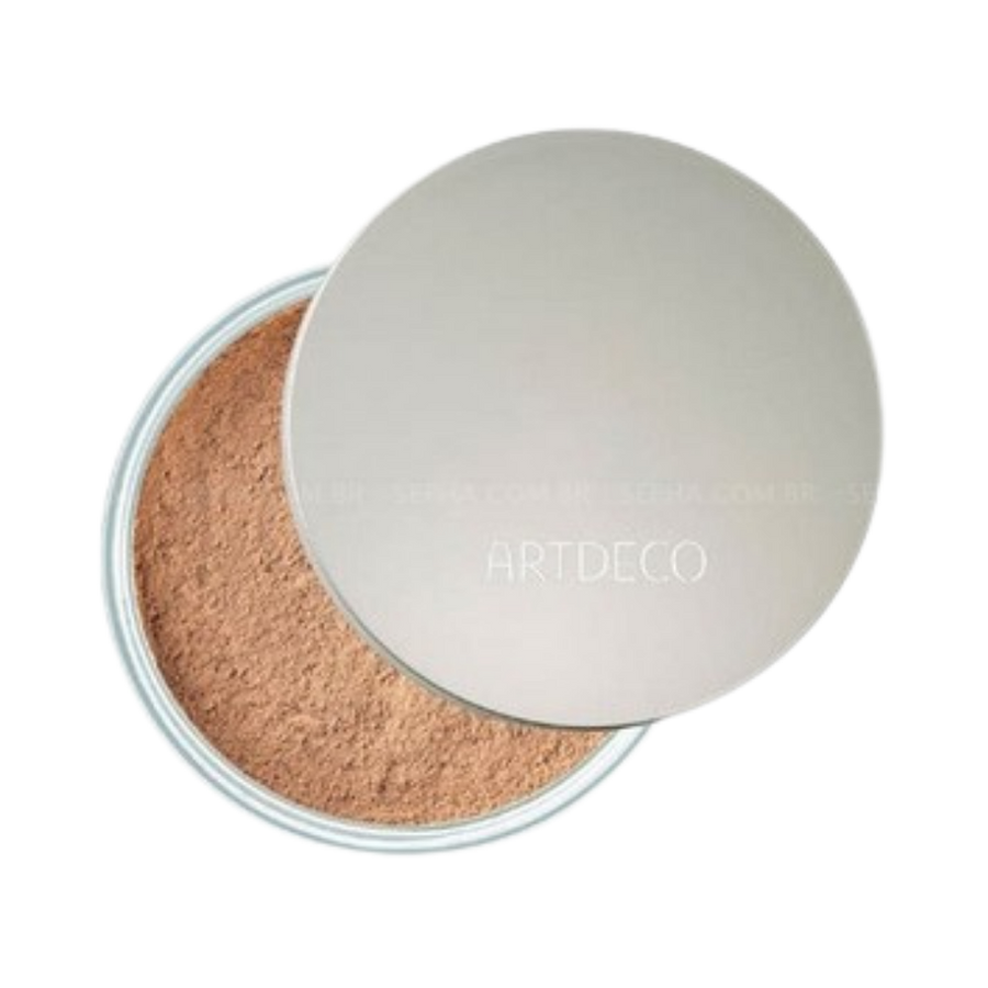 ARTDECO loose powder in a transparent container with a silver lid, offering a natural finish.