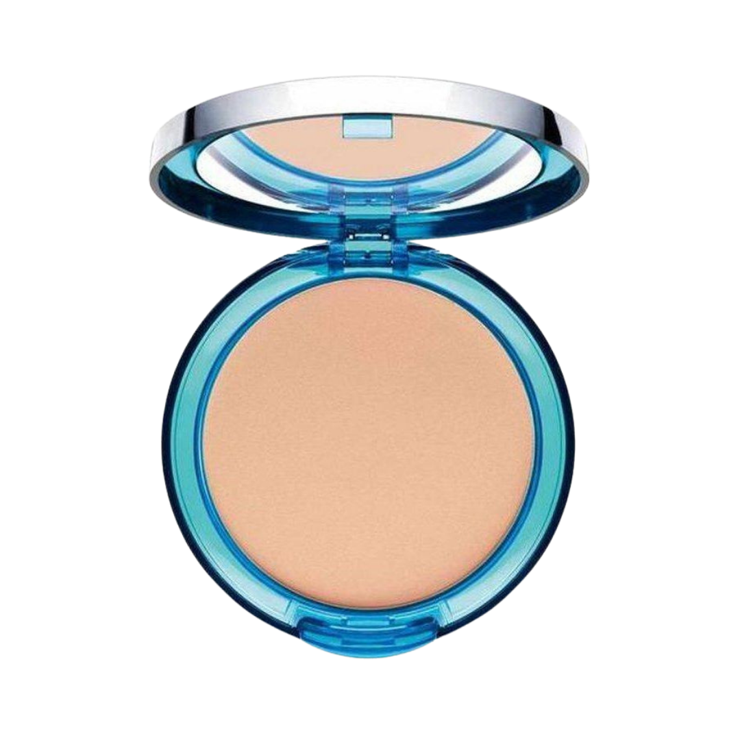 ARTDECO compact powder in beige, inside a blue circular compact with a mirror and silver lid.
