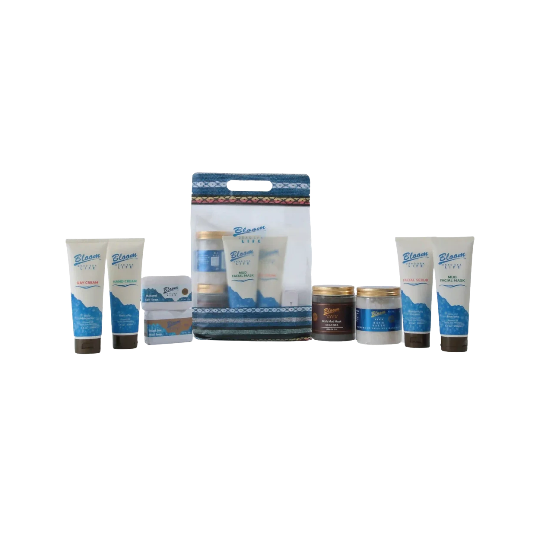 Bloom Dead Sea Life skincare set with creams, scrubs, masks, jars, and patterned carry bag.