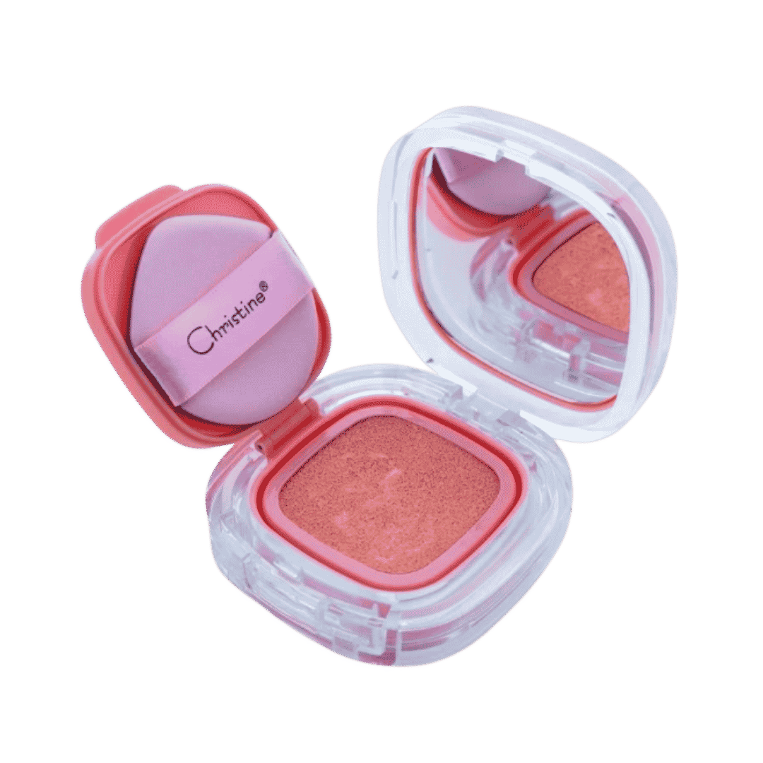 Christine Cushion Blusher, 15g, clear coral compact with mirror, pink puff, and peach-toned cushion blush.