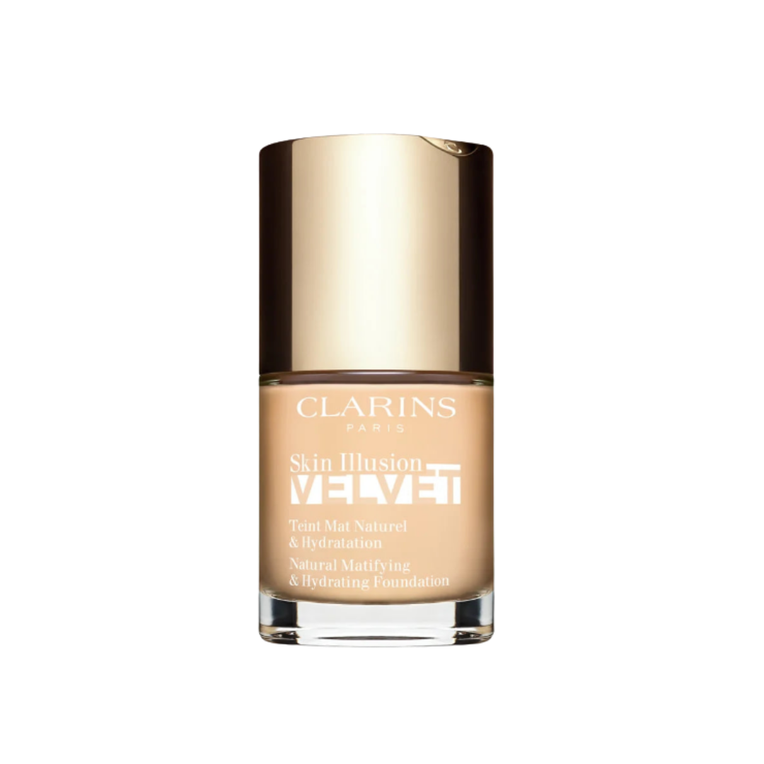 Clarins Skin Illusion Velvet natural mattifying and hydrating foundation in glass bottle with gold cap.