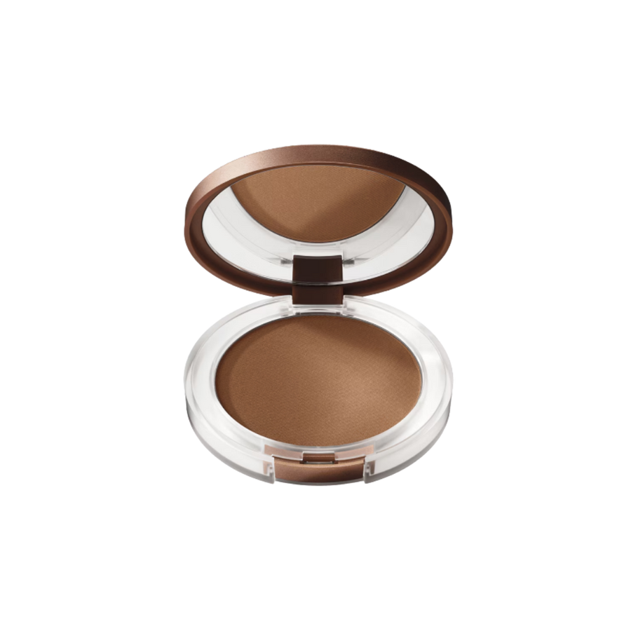 Open compact bronzing powder in clear case with brown lid and mirror, warm tan shade
