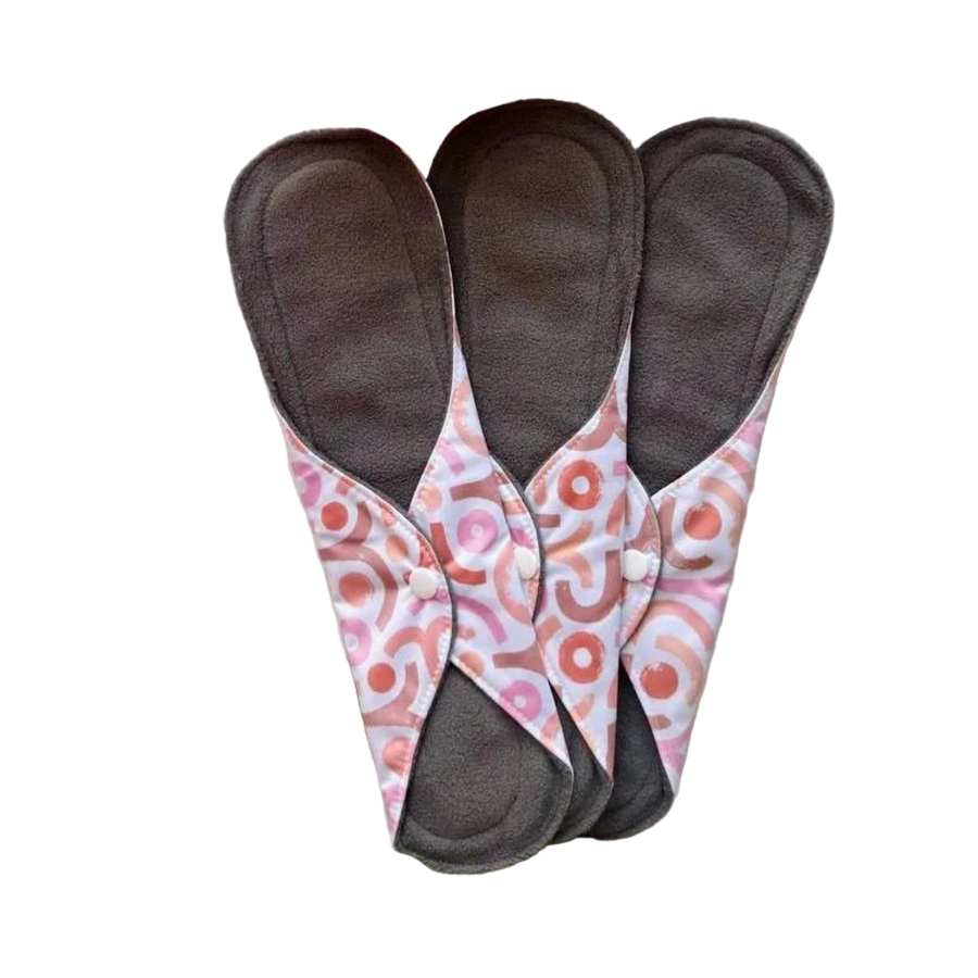 DAWRATY reusable menstrual pads, size L, three dark gray pads with pink patterned wings and snap buttons