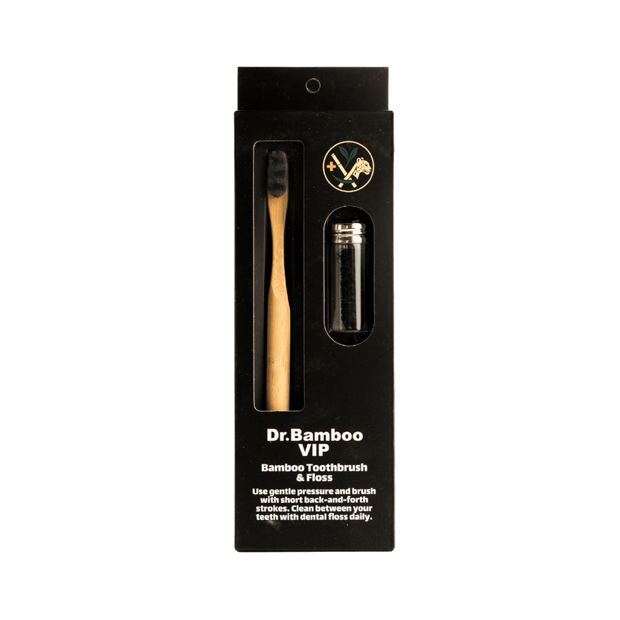 "Dr. Bamboo VIP Bamboo Toothbrush & Dental Floss, packaged in a black box with a bamboo toothbrush and floss inside."