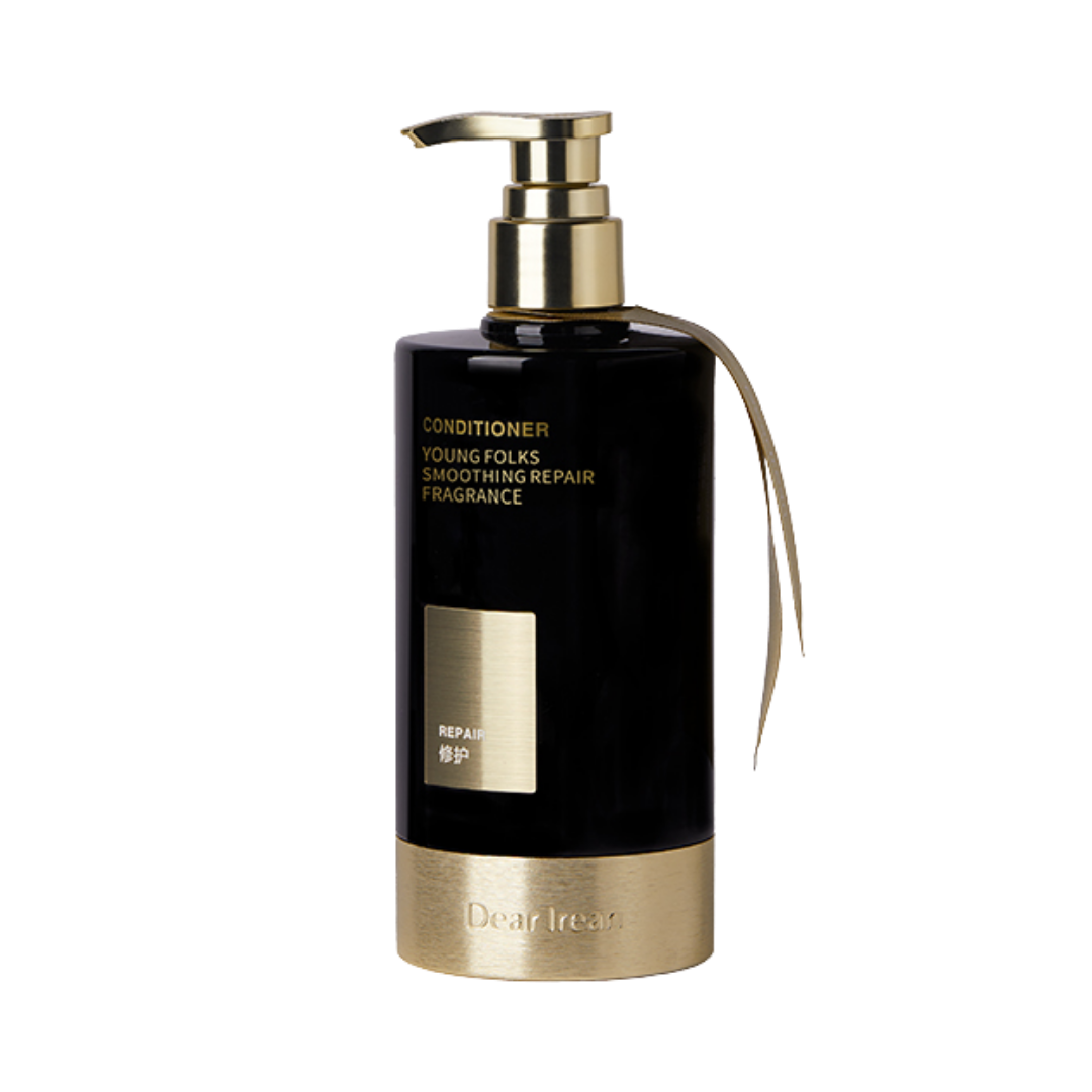 Dearreian Young Folks Smoothing Repair Conditioner, black bottle with gold accents, pump dispenser, for hair repair and fragrance.
