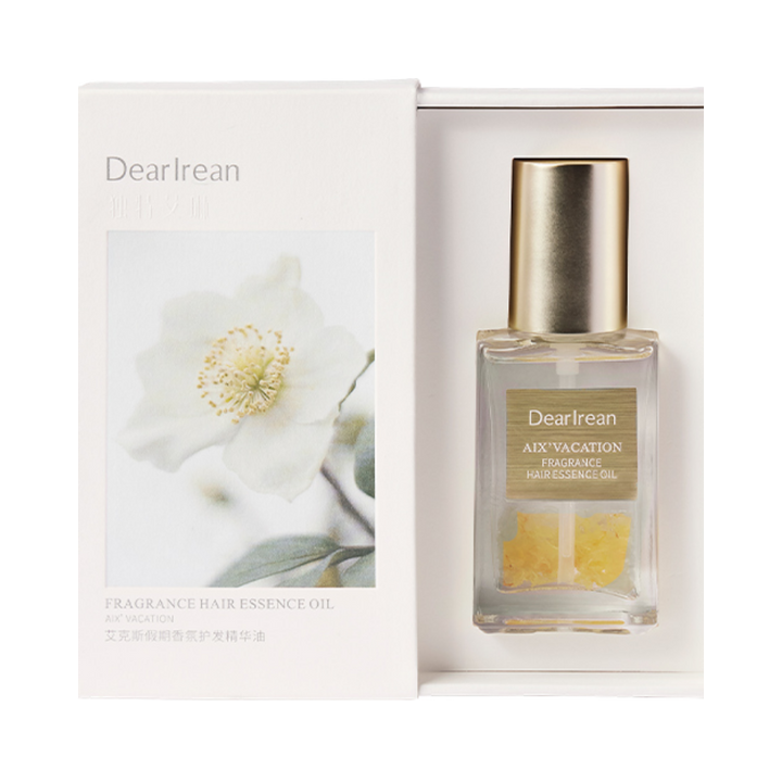 Dearreian AIX Vacation Fragrance Hair Essence Oil, clear bottle with gold cap, floral packaging, for hair nourishment and fragrance.
