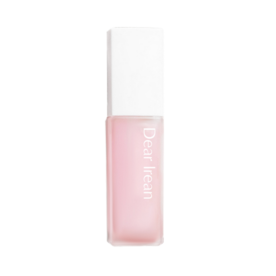 Dearreian fragrance oil, pink liquid in a square glass bottle with a white cap and minimalist label.
