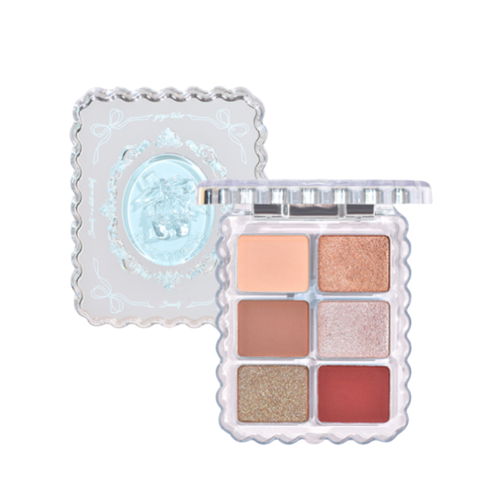 GOGO TALES Crystal Slipper Dreamy Eyeshadow Palette with six warm-toned shades and clear scalloped packaging, 7.8g.