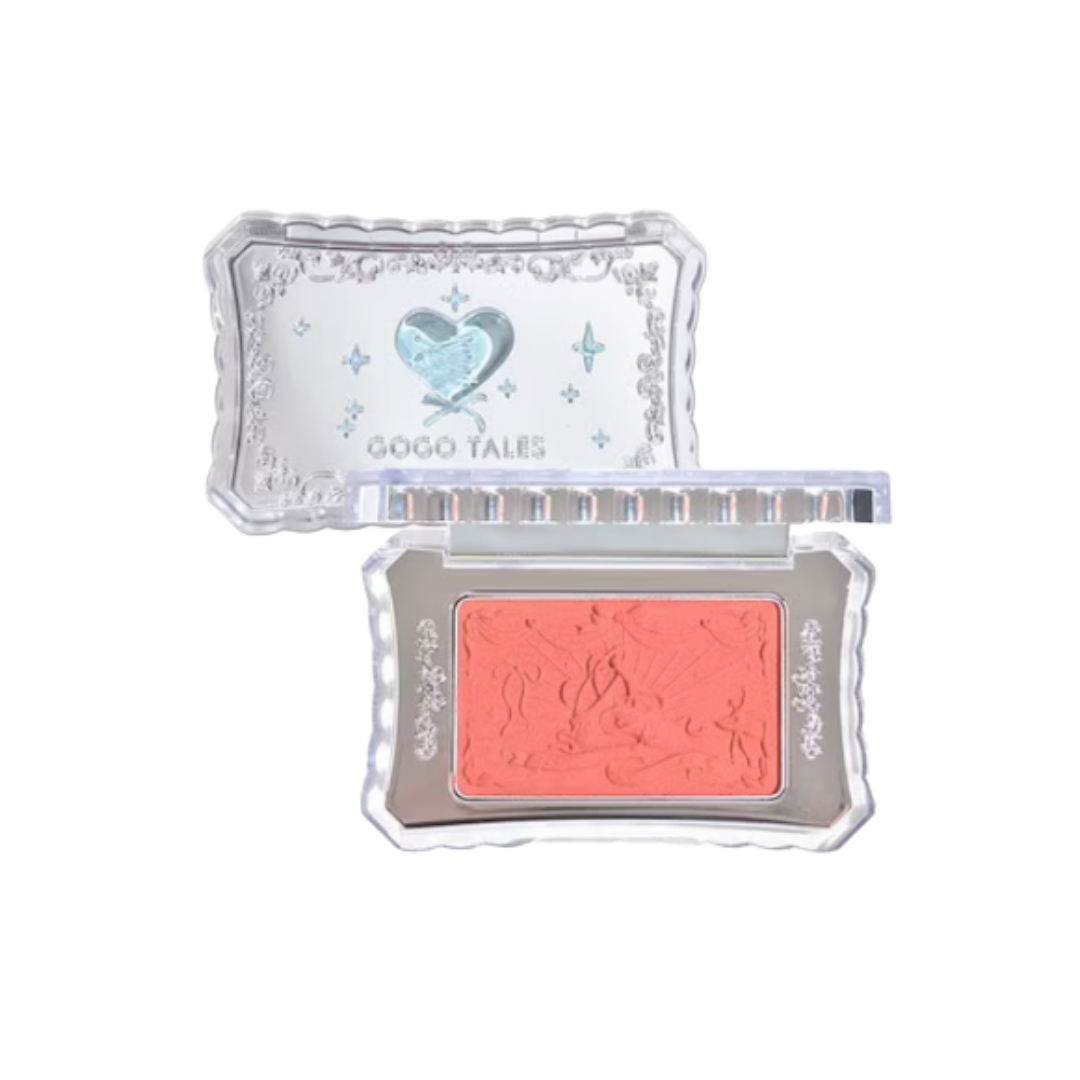 GOGO TALES compact coral blush with clear decorative case, embossed powder pan, and silver-toned details.