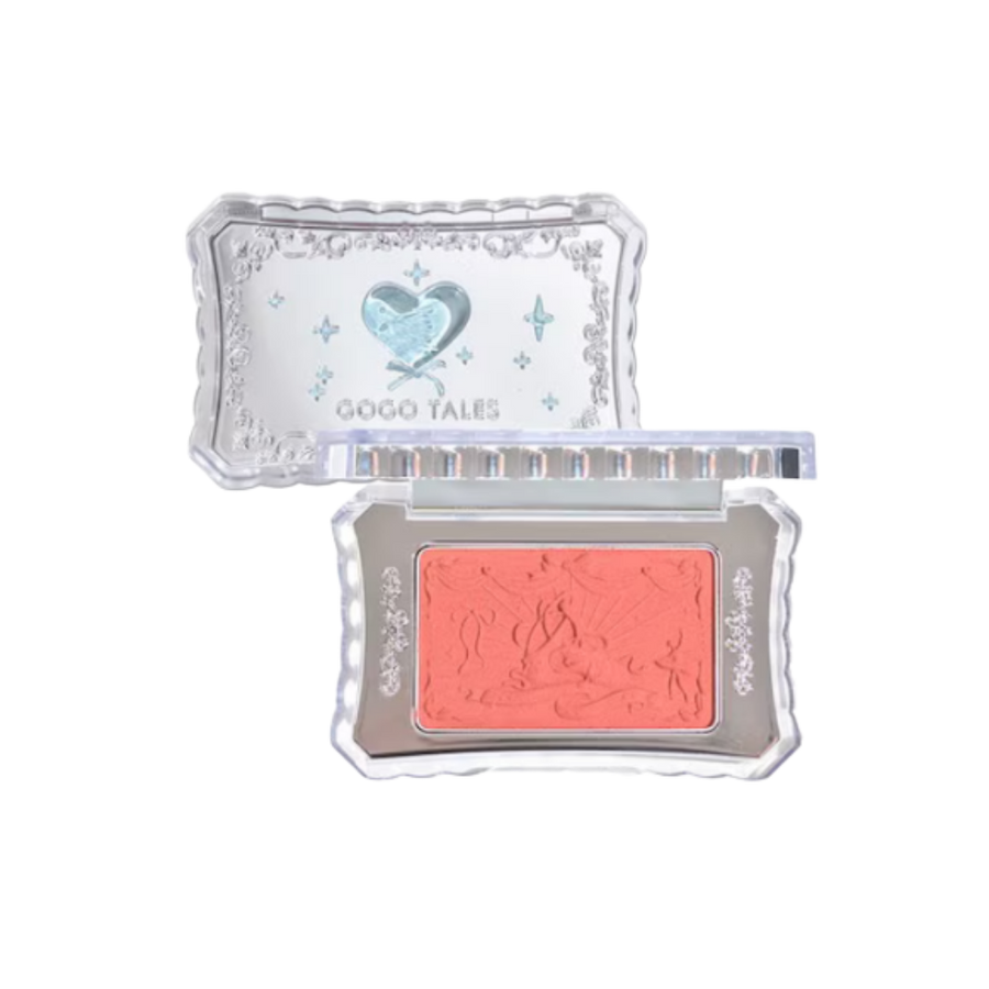 GOGO TALES compact coral blush with clear decorative case, embossed powder pan, and silver-toned details.