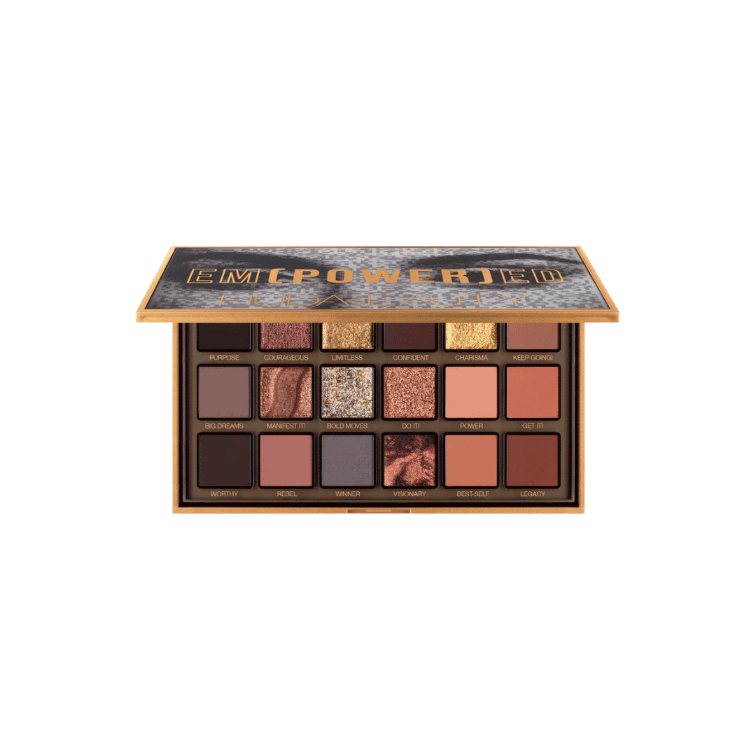 Huda Beauty Empowered eyeshadow palette with open gold compact and eighteen neutral shimmer shades