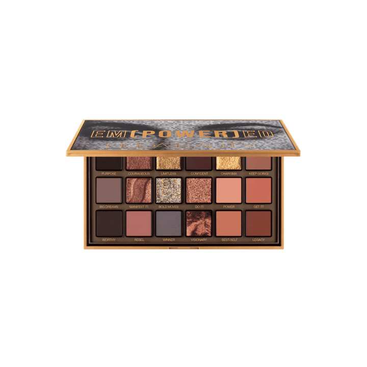 Huda Beauty Empowered eyeshadow palette with open gold compact and eighteen neutral shimmer shades