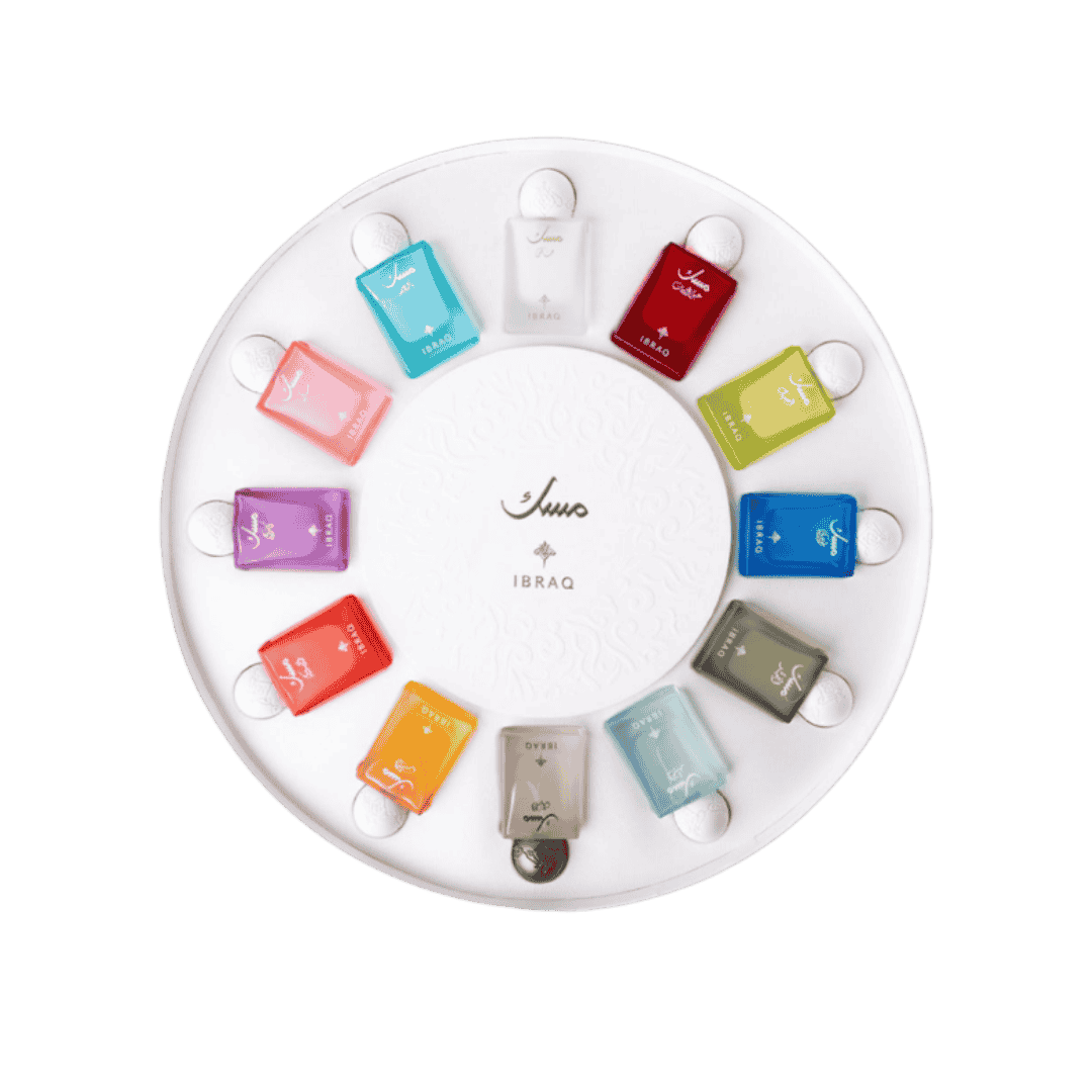 Ibraq Musks collection, featuring 12 different fragrances in colorful bottles arranged in a circular display.