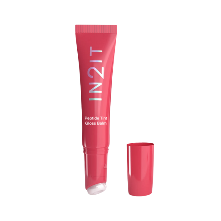 IN2IT Peptide Tint Gloss Balm lip gloss balm in a red-pink tube with squeeze applicator and matching cap.