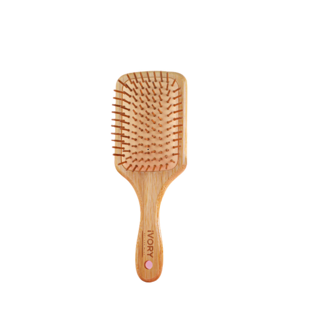 Ivory wooden hairbrush with soft pins, designed for detangling and smoothing hair.