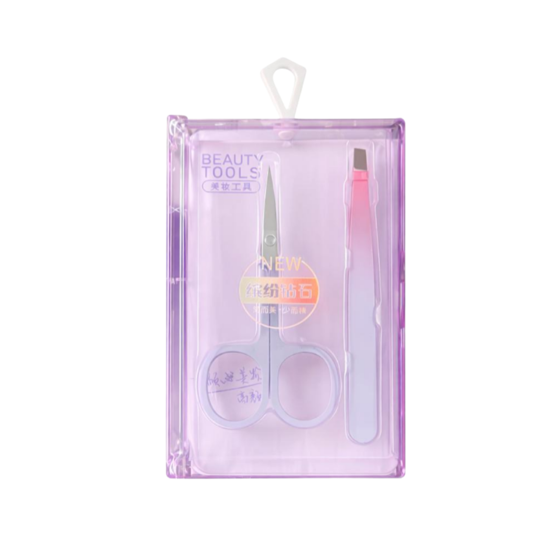 Beauty tools set in purple case including stainless steel scissors and pink eyebrow razor.