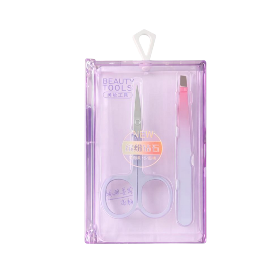 Beauty tools set in purple case including stainless steel scissors and pink eyebrow razor.