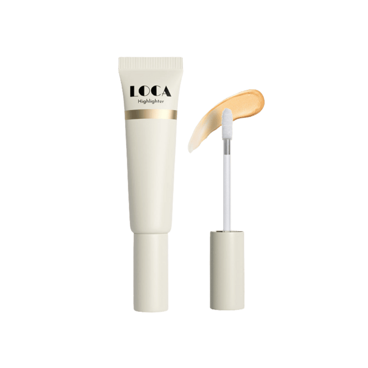 LOCA Highlighter cream, beige tube with doe-foot applicator and golden shimmer swatch