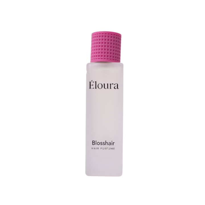 Éloura Blosshair Hair Perfume in a frosted white bottle with a textured pink cap.