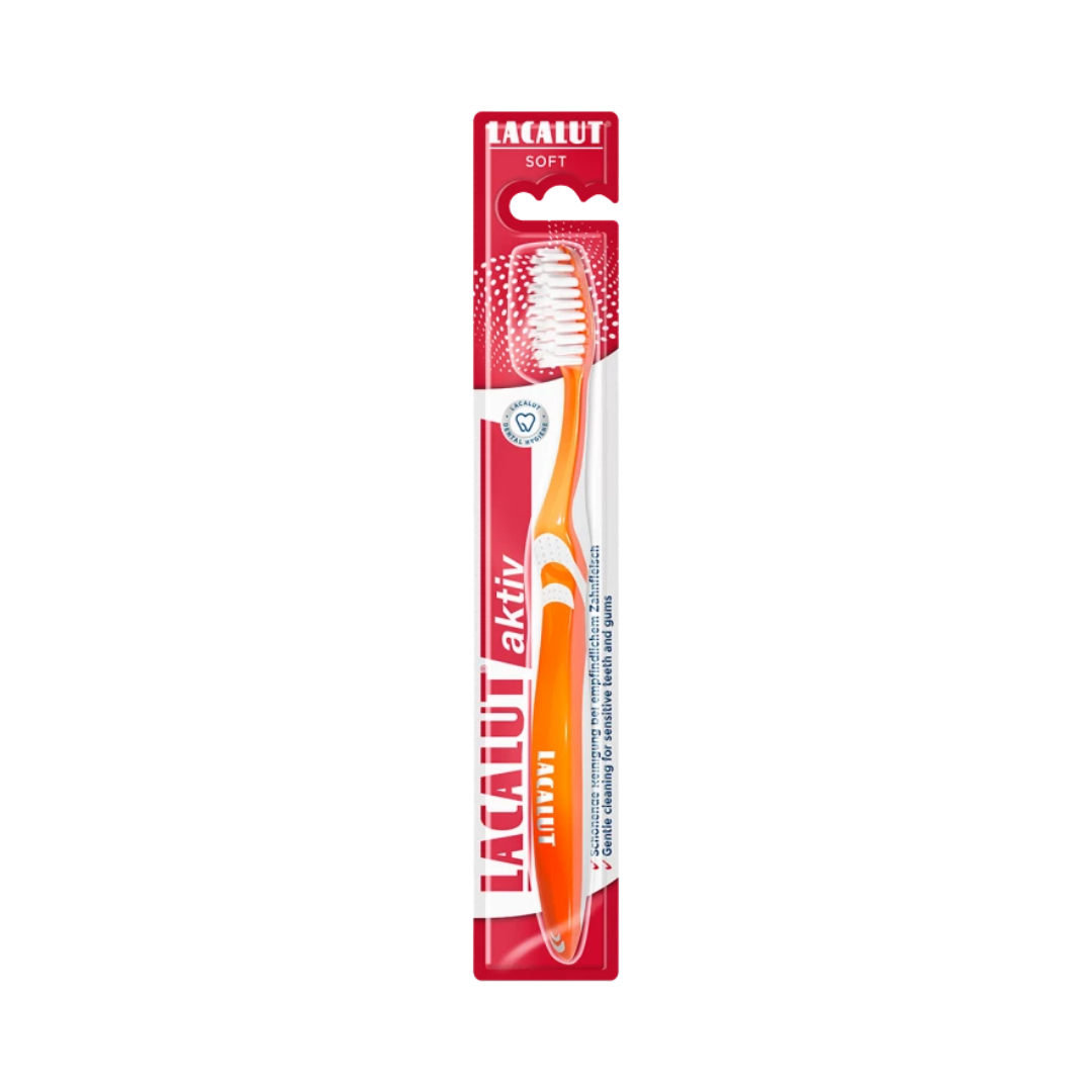 Lacalut Aktiv soft toothbrush with orange handle, soft white bristles, single toothbrush in red blister packaging
