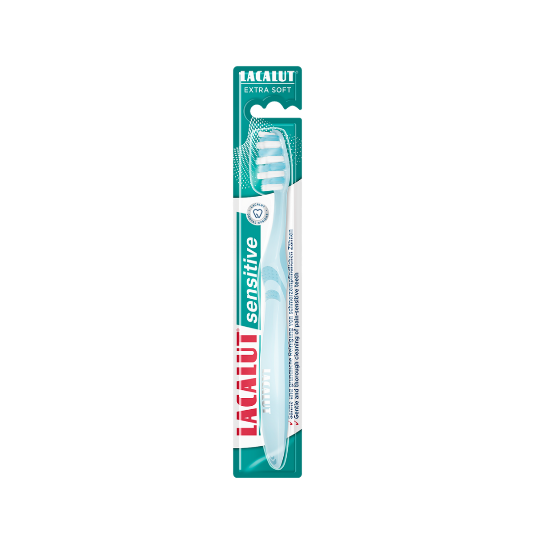 Lacalut Sensitive extra soft toothbrush with light blue handle, white bristles, and green blister packaging