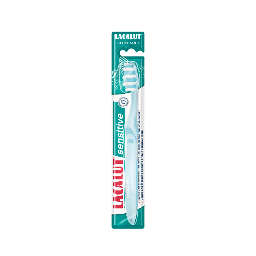 Lacalut Sensitive extra soft toothbrush with light blue handle, white bristles, and green blister packaging