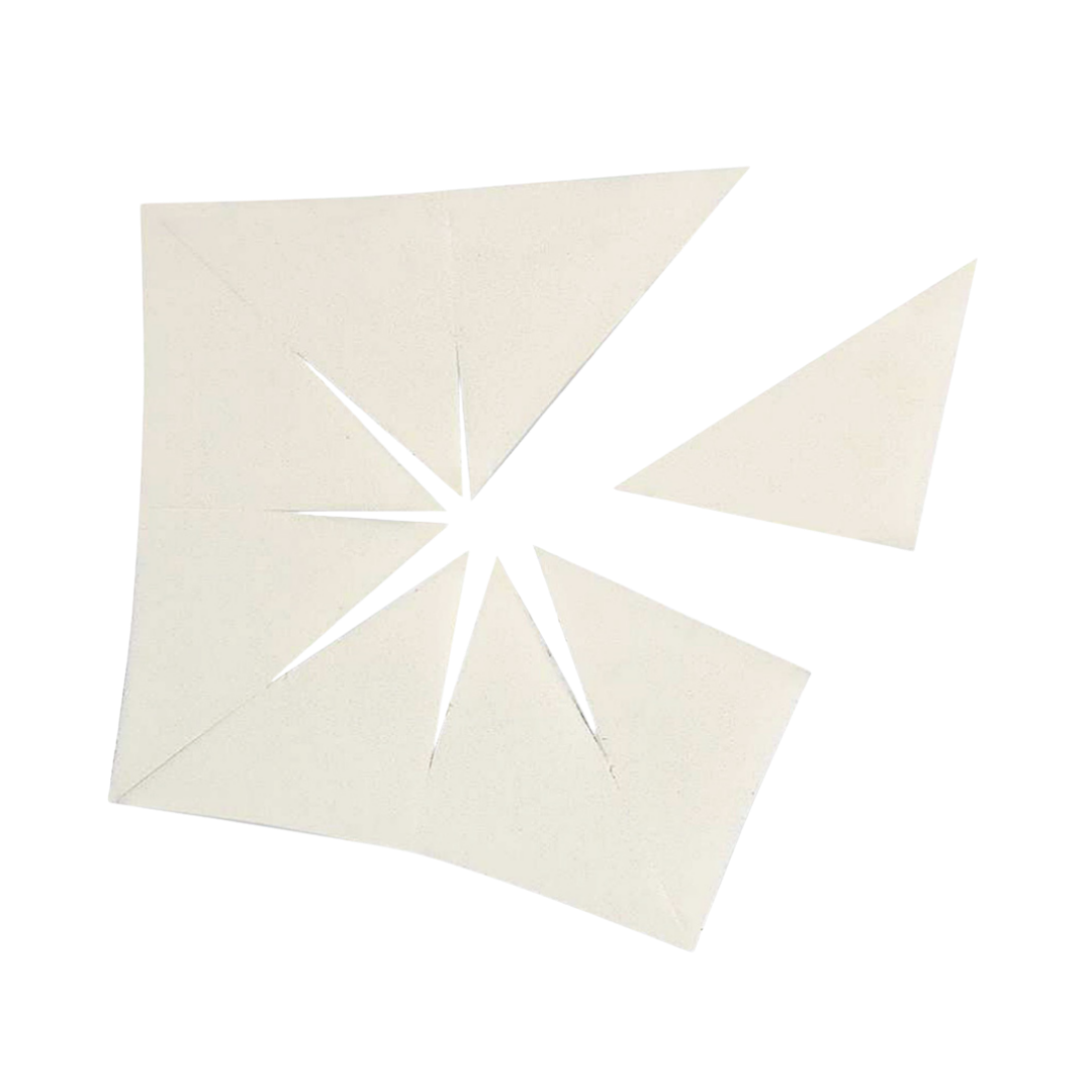 A set of white triangular makeup wedges, cut into pieces for application or blending.