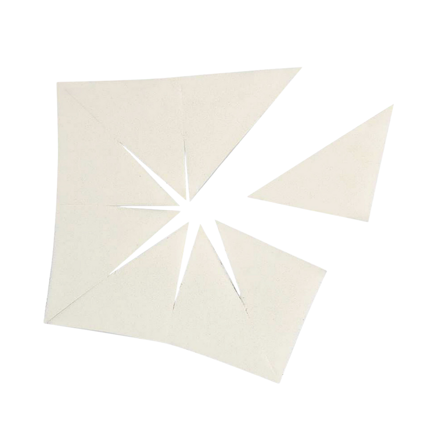 A set of white triangular makeup wedges, cut into pieces for application or blending.