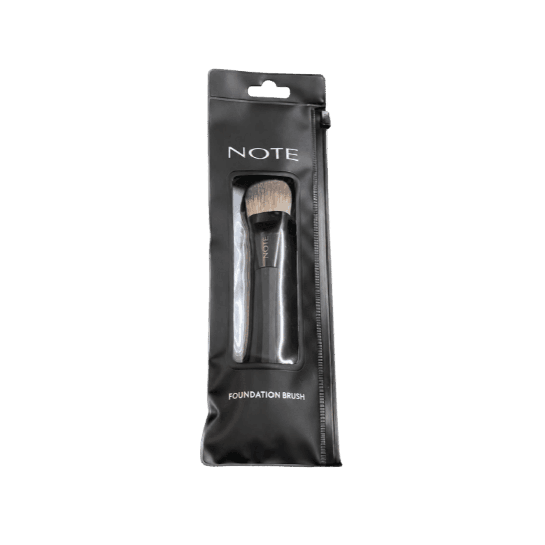 NOTE foundation brush with angled dense bristles, black handle, and clear-window zippered pouch packaging.