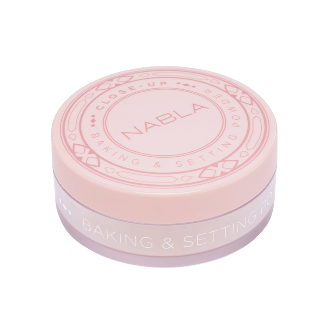NABLA Close-Up Baking & Setting Powder in soft pink round container for makeup setting and baking.