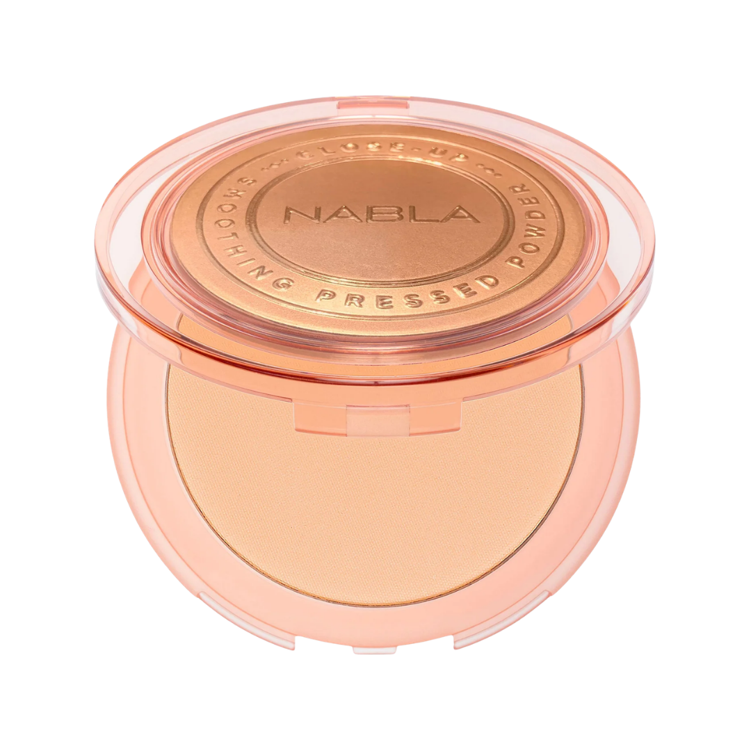 NABLA Close-Up Smoothing Pressed Powder compact in peach case with embossed lid.
