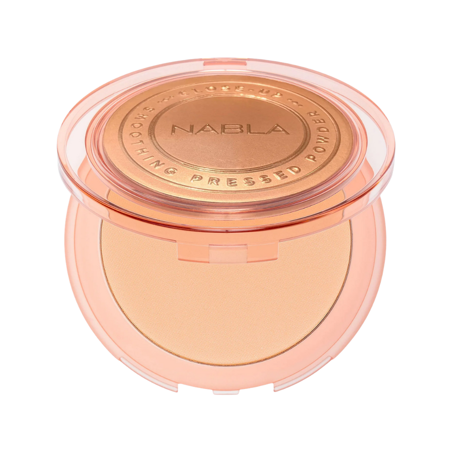 NABLA Close-Up Smoothing Pressed Powder compact in peach case with embossed lid.

