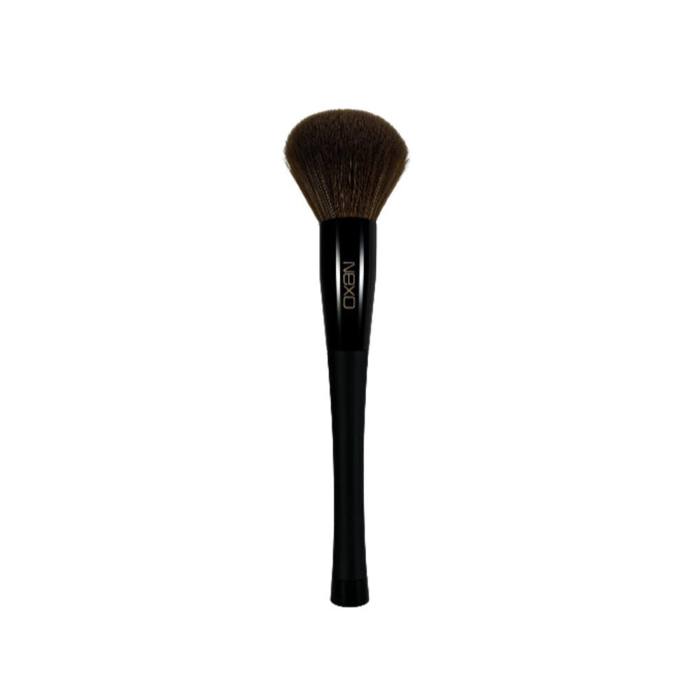 NEXO makeup powder brush with dense brown bristles, black tapered handle, single cosmetic brush tool