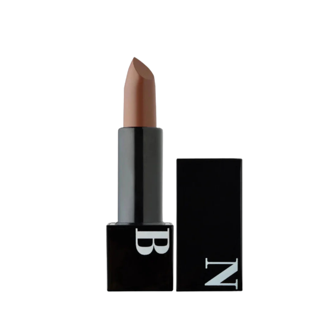 Black lipstick with nude beige bullet, square black tube, white “B” logo, removable black cap with “N”.