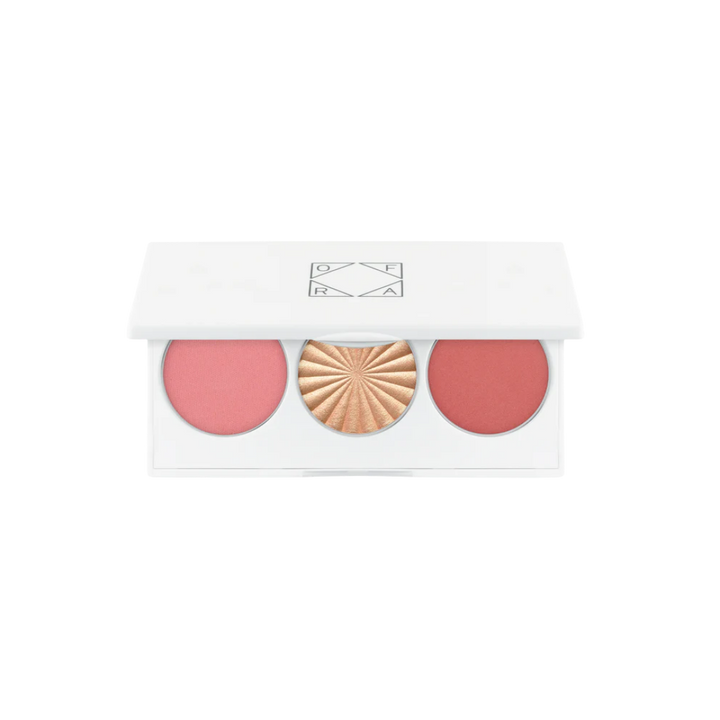 OFRA three-pan blush and highlighter palette, pink and coral blushes with gold highlighter, white compact