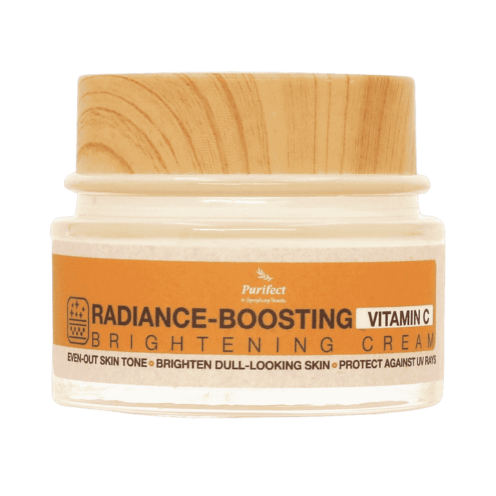 Purifect Radiance Boosting Vitamin C brightening cream jar with wooden lid and orange product label
