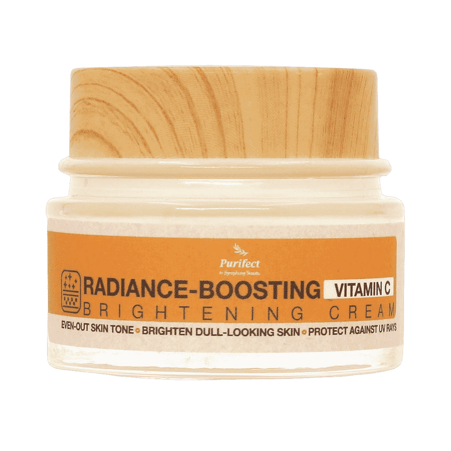 Purifect Radiance Boosting Vitamin C brightening cream jar with wooden lid and orange product label
