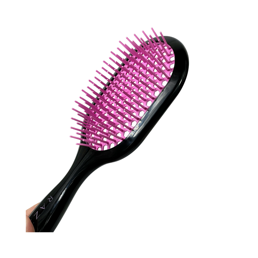 RAZZO hair brush with black handle, pink vented cushion, and flexible plastic bristles for detangling