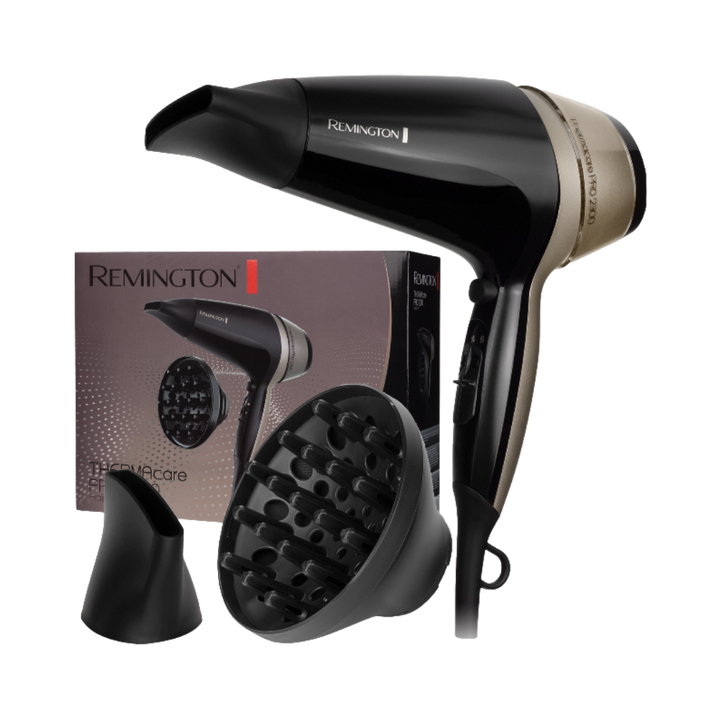 This image features a Remington hair dryer with a black and gold design, packaged with two attachments: a concentrator nozzle and a diffuser.