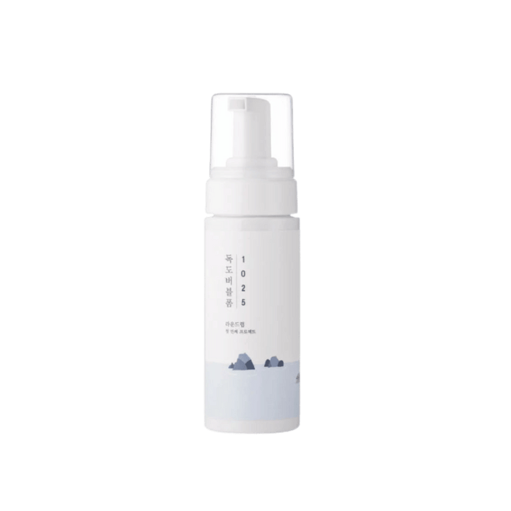 White Korean 1025 foaming cleanser pump bottle with clear cap and pale blue label