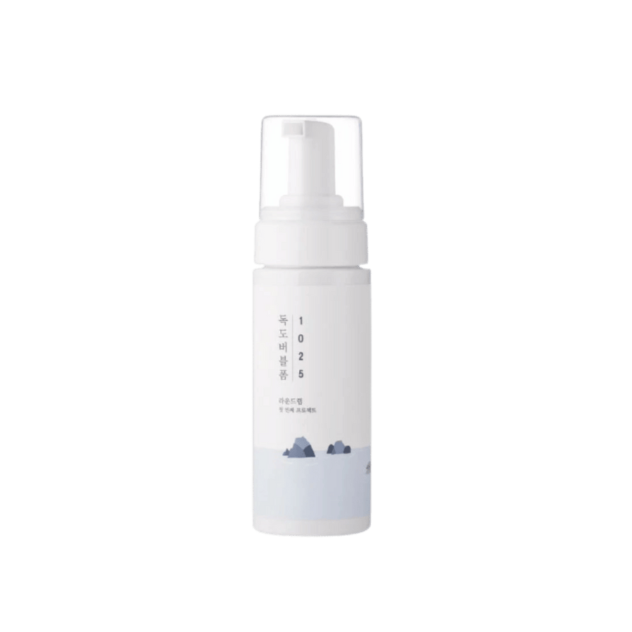 White Korean 1025 foaming cleanser pump bottle with clear cap and pale blue label