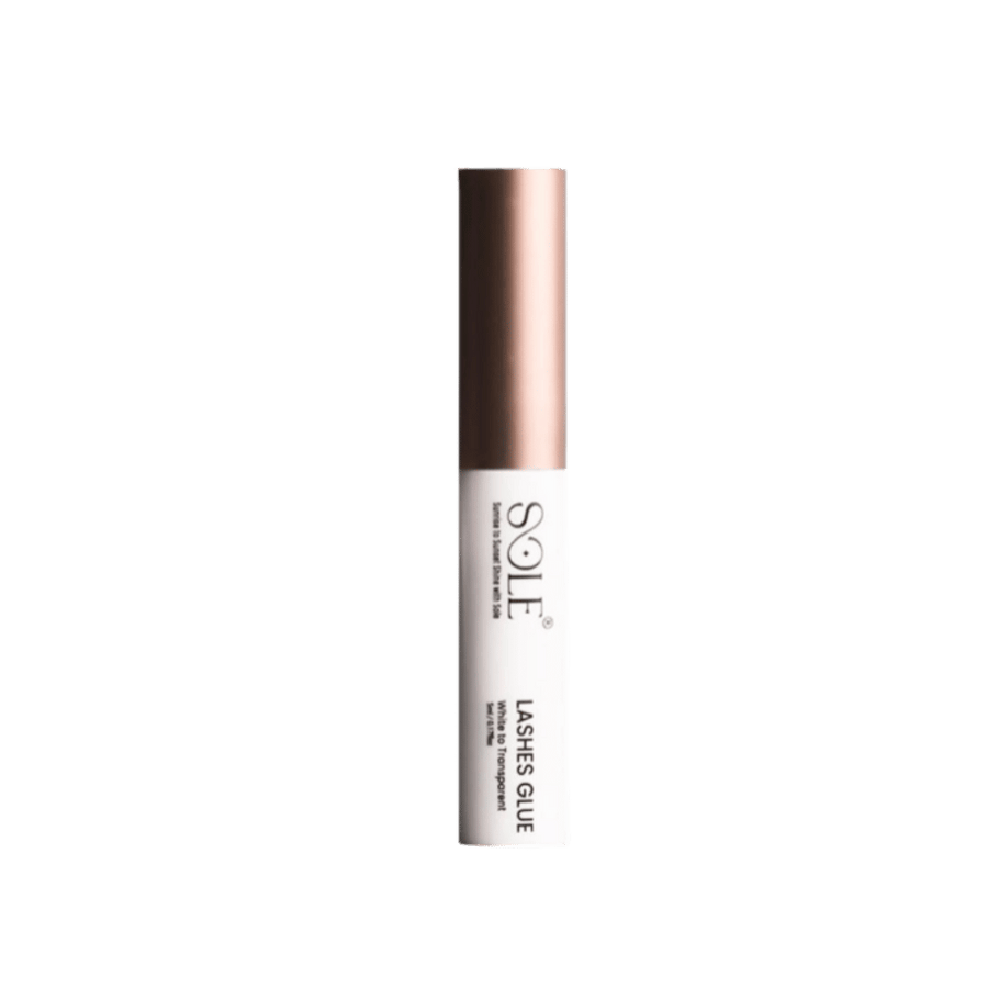 Sole Lashes Glue white tube with a rose gold cap.
